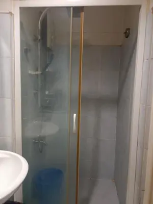 a shower with a glass door in a bathroom at Sea Residence Tower EF in Manila