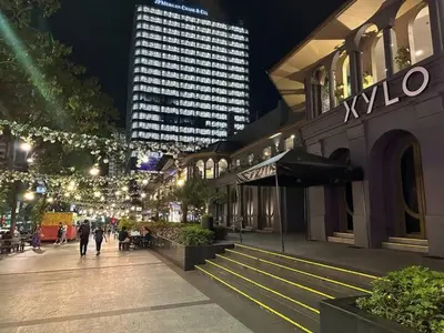 a city street at night with a building with lights at Uptown Parksuite 1 BR Tower 2 BGC Taguig in Manila