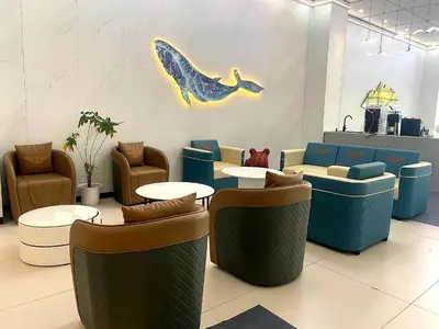 a restaurant with tables and chairs and a whale on the wall at City Center Executive Hotel Manila Near Airport, PITX, Solaire, City of Dreams, Okada & Ayala Mall in Manila