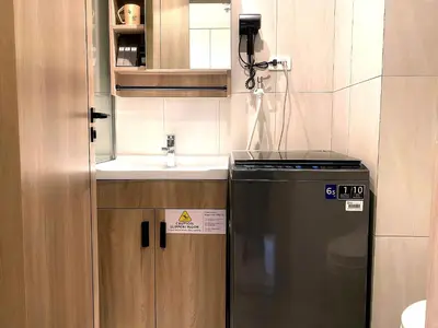 a small kitchen with a sink and a refrigerator at City Center Executive Hotel Manila Near Airport, PITX, Solaire, City of Dreams, Okada & Ayala Mall in Manila