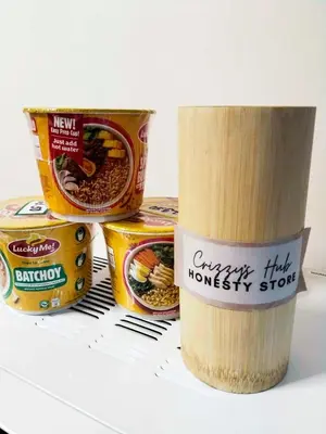 a stack of canned food sitting on top of a table at Crizzy's Hub Gabrielle at Shore Residences in Manila