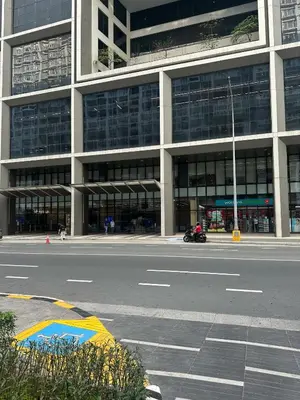 an empty street in front of a large building at SHORE RESIDENCES NEAR Moa in Manila