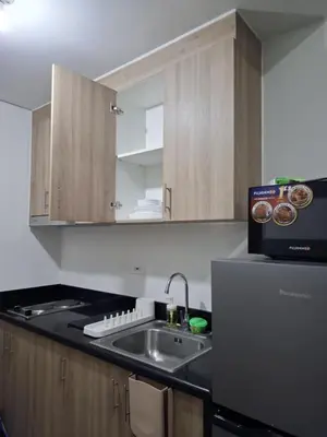 a kitchen with a sink and a counter top at Shore2n3 Residences MOA Pasay City Near NAIA Airport in Manila