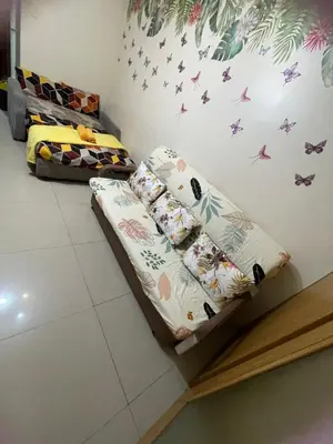 a bed in a room with butterflies on the wall at Big cut room 3beds 1103 tower A in Manila
