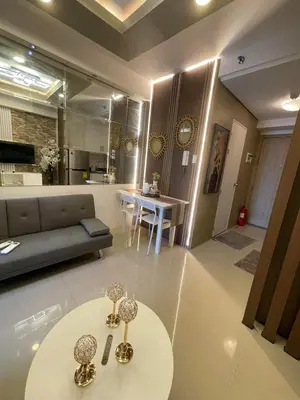 a living room with a couch and a table at SMDC SHORE 1 Residences, TOWER A in Manila