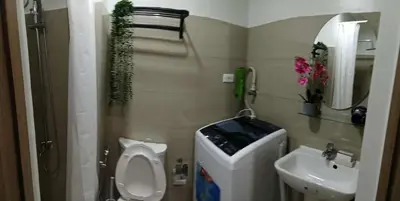 a small bathroom with a toilet and a sink at Shore 2 Staycation nice Homes in Manila