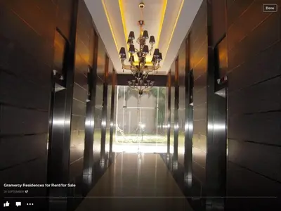 a hallway with a chandelier in a building at New York- Inspired Condo in Makati in Manila