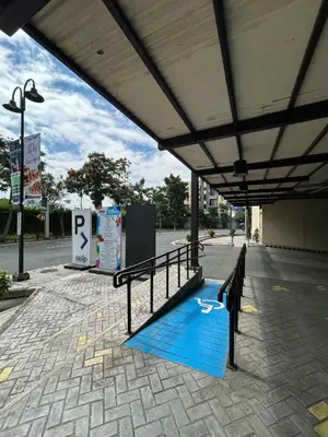 a blue mat on the side of a bus stop at Cozy Place near Eastwood in Manila