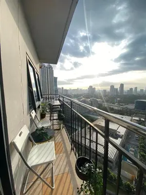 a balcony of a building with a view of a city at 2 BR Unit with 180 degree view in Ortigas in Manila
