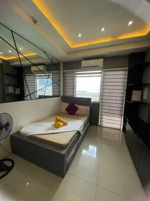 a small bedroom with a bed in a room at 1553 Moa view bigcut in Manila