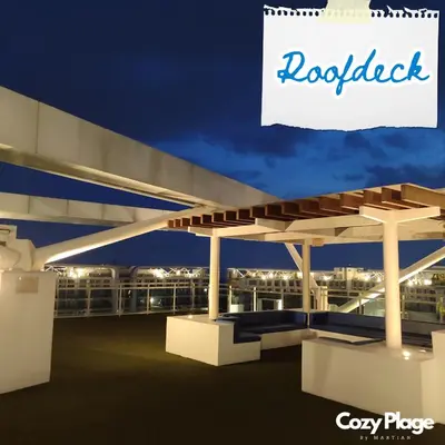 a view of a gas station at night at Affordable Cozy Plage by Martian in Manila