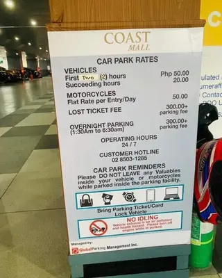 a sign for a car park rates at a store at 1BR Solana Suite 5 at Coast Residences in Manila