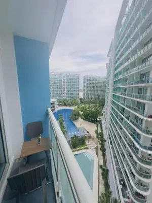 a view of the pool from the balcony of a hotel at Azure Urban Resort Residences in Manila