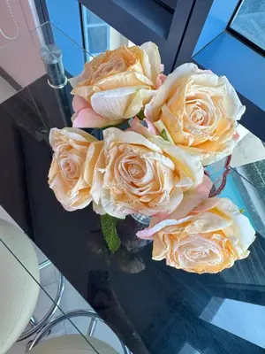 a bouquet of roses sitting on top of a table at Grand Riviera Suites 1201 Near US Embassy and St Luke's Medical Center Extension Clinic SLEC by Prime Stay in Manila