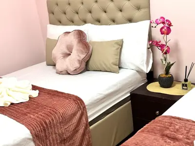 a small bedroom with a bed with a headboard at Grand Riviera Suites 1201 Near US Embassy and St Luke's Medical Center Extension Clinic SLEC by Prime Stay in Manila