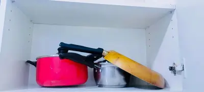 a knife sitting on top of a pot at Avida sm sucat quest house condo hotel in Manila