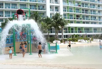 a group of people playing in a water park at Azure Urban Resort Staycation in Manila