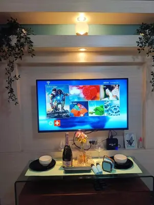 a computer monitor sitting on top of a table at Shell Residences - MOA in Manila