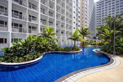 a swimming pool in front of a building at Shore B 524 in Manila