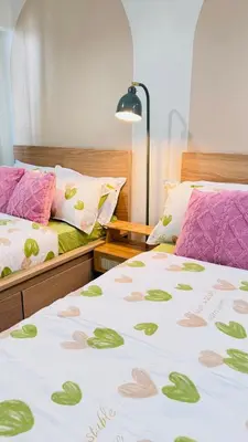 a bedroom with two beds with hearts on the sheets at Japanese Inspired Hotel at MOA in Manila