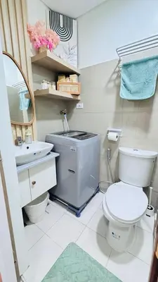 a bathroom with a toilet and a sink at Japanese Inspired Hotel at MOA in Manila