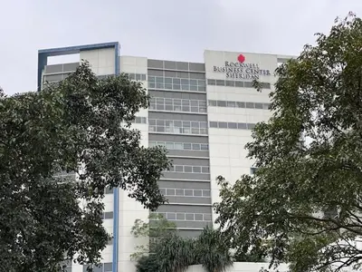 a building with a sign on the side of it at SMDC Apartment in FAME in Manila