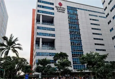 a tall building with a sign on the side of it at SMDC Fame Condo in Manila