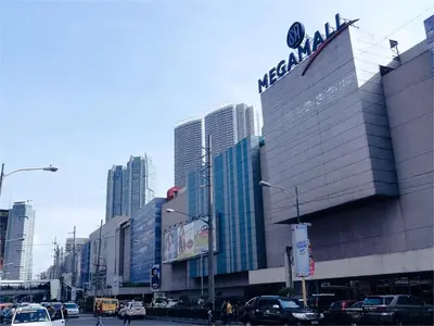 a large building with a sign on the side of it at SMDC Fame Residences in Manila