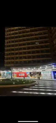 a large building in front of a building at night at Smdc green 2 residence in Pasong Bayog