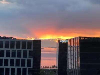 a view of the sunset from a building at 1BR Room-Stunning MOA view FIREWORKS in Manila