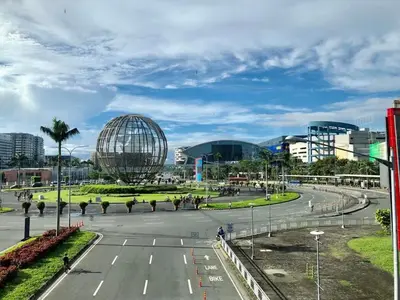 a street in a city with some buildings and a city at 1BR Room-Stunning MOA view FIREWORKS in Manila