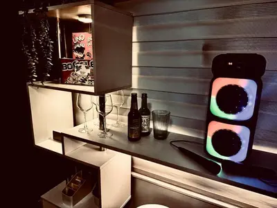a traffic light with bottles and glasses on a counter at Luxurious 2 Bedroom Oasis in Air Residences with Bar KTV and Games in Manila