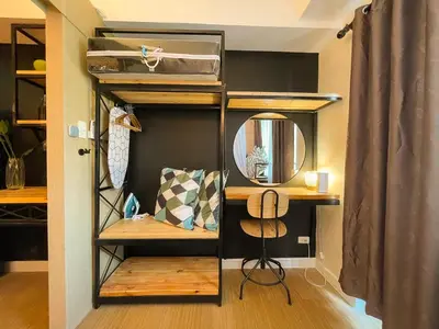 a room with a bunk bed and a mirror at Houzz 845 by Houzztelity in Manila