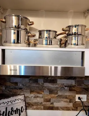 two pots and pans on a shelf in a kitchen at Air Residence T1 Amazing Makati Luxury Condo 66 sq m 300Mbps Fast in Manila