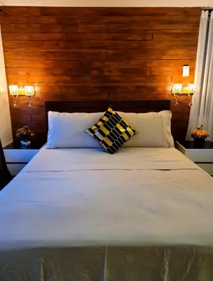a bedroom with a large white bed with two pillows at Air Residence T1 Amazing Makati Luxury Condo 66 sq m 300Mbps Fast in Manila