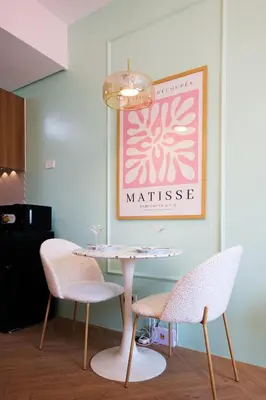 a table and two chairs in a room at Blush Haven with Netflix, WiFi and Balcony near Glorietta in Manila
