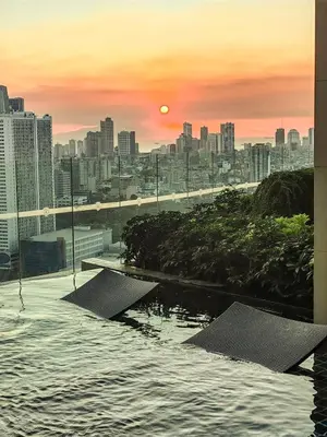 a view of a city at sunset from a building at Studio Unit with Balcony in The Gramercy Residences in Manila