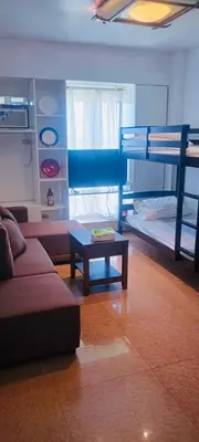 a living room with a couch and a bunk bed at Avida sm sucat condotel in Manila