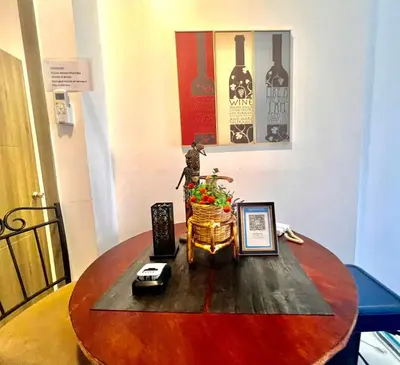 a wooden table with a vase on top of it at Ortigas Business District Prime Accommodations in Manila