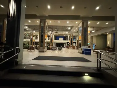 a lobby with a large rug in the middle of a building at FLAIR Condotel 1 BR Near MRT EDSA Shangrila Megamall Lightmall in Manila