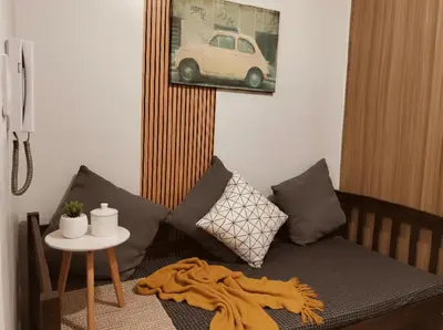 a living room with a couch and a table at Mall Of Asia - Aseana Prime Accommodations in Manila