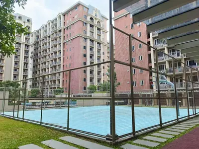 a swimming pool in a city with tall buildings at Pool View BP1043 in Manila