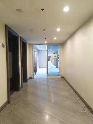 an empty hallway with a door in a building at Pool View BP1043 in Manila