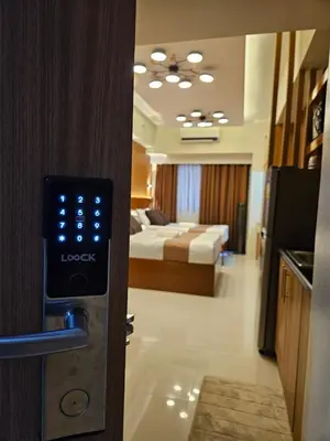 an open door to a room with a bedroom at Modern Condotel 2Beds near MOA in Manila