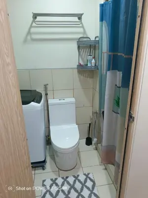 a small bathroom with a toilet in a room at SMDC Field REsidences condo unit in Manila