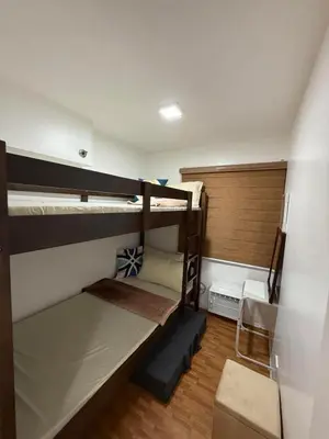 a room with two bunk beds in a room at Trendy 3BR Loft Condo along EDSA in Manila