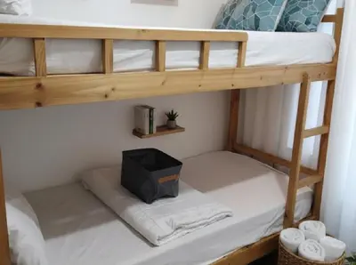 a bunk bed with a tv on the bottom bunk at Mall Of Asia - Aseana Super Value for Money in Manila