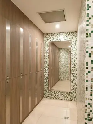 a bathroom with a mirror and a walk in shower at BP952 With Balcony and River View in Manila