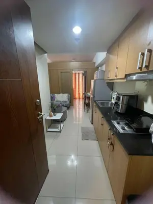 a kitchen with a sink and a counter top at 1441-Pool view 1BR 1 sofa Bed 1 Extra mattress in Manila