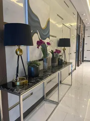 a table with potted plants on it in a hallway at D&M cosy staycation in Manila